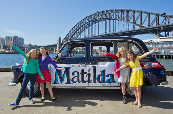 Australian Matildas with their London taxicab. Sydney Harbour bridge in the background. Photo by James Morgan